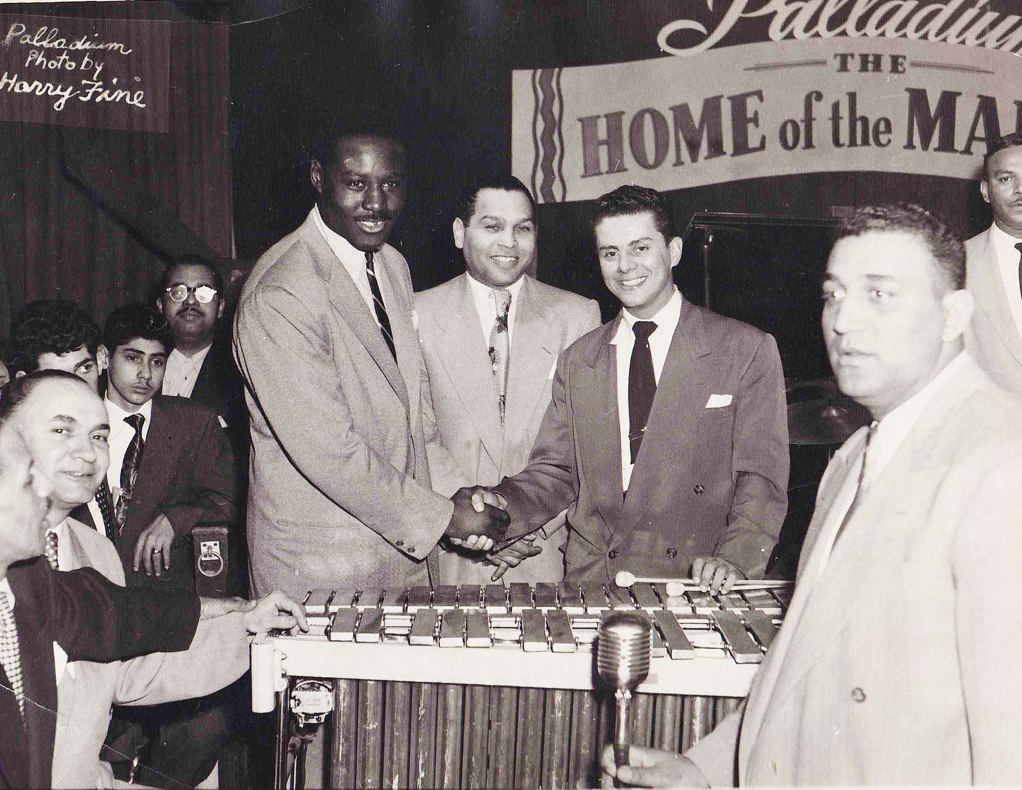 Historic black-and-white photograph of Tito Puente and fellow musicians at the Palladium